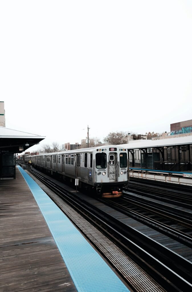 Modern grey passenger train standing in a railway station