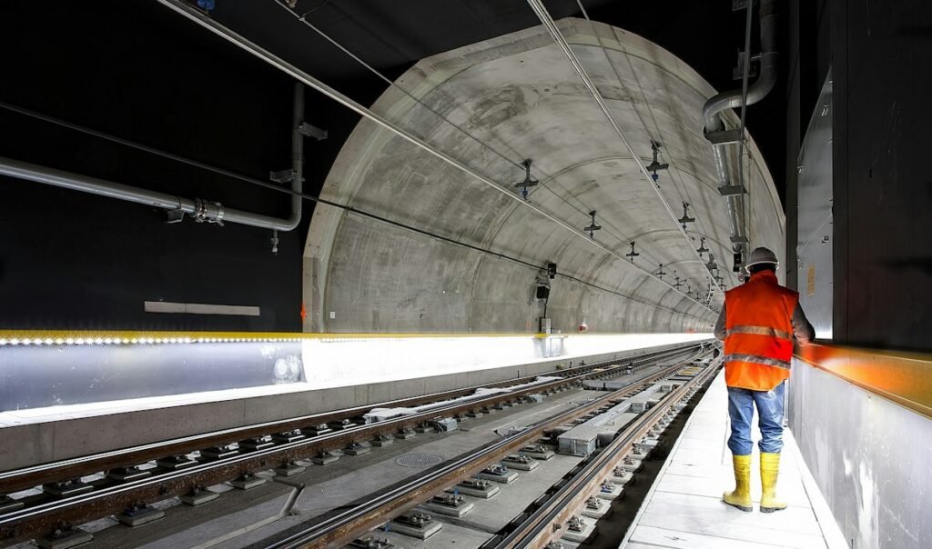 Rail engineer standing beside a railway track