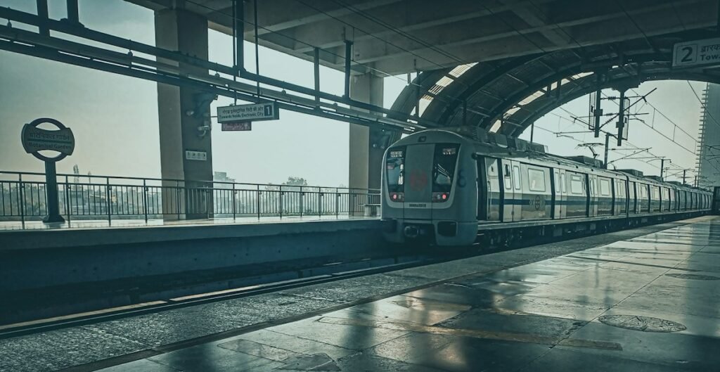 Passenger train arriving at a station platform