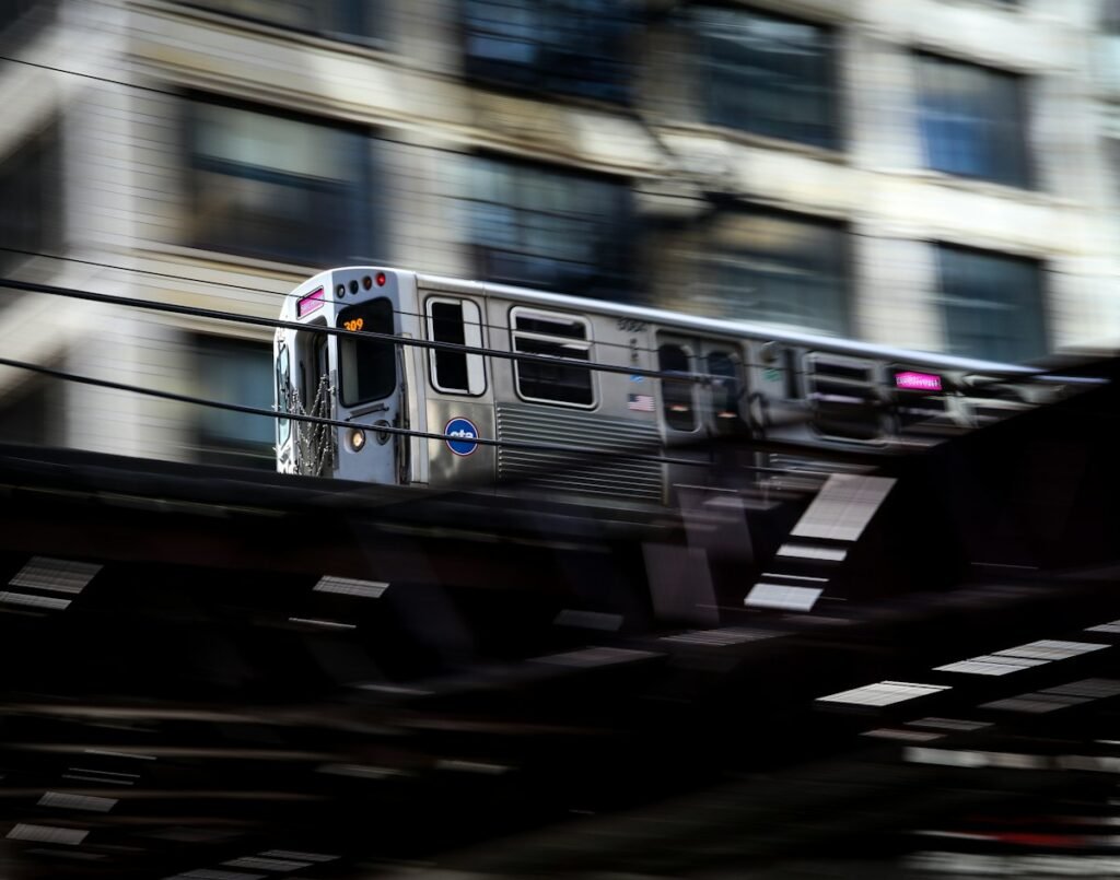 Long exposure of a train moving through a railway station